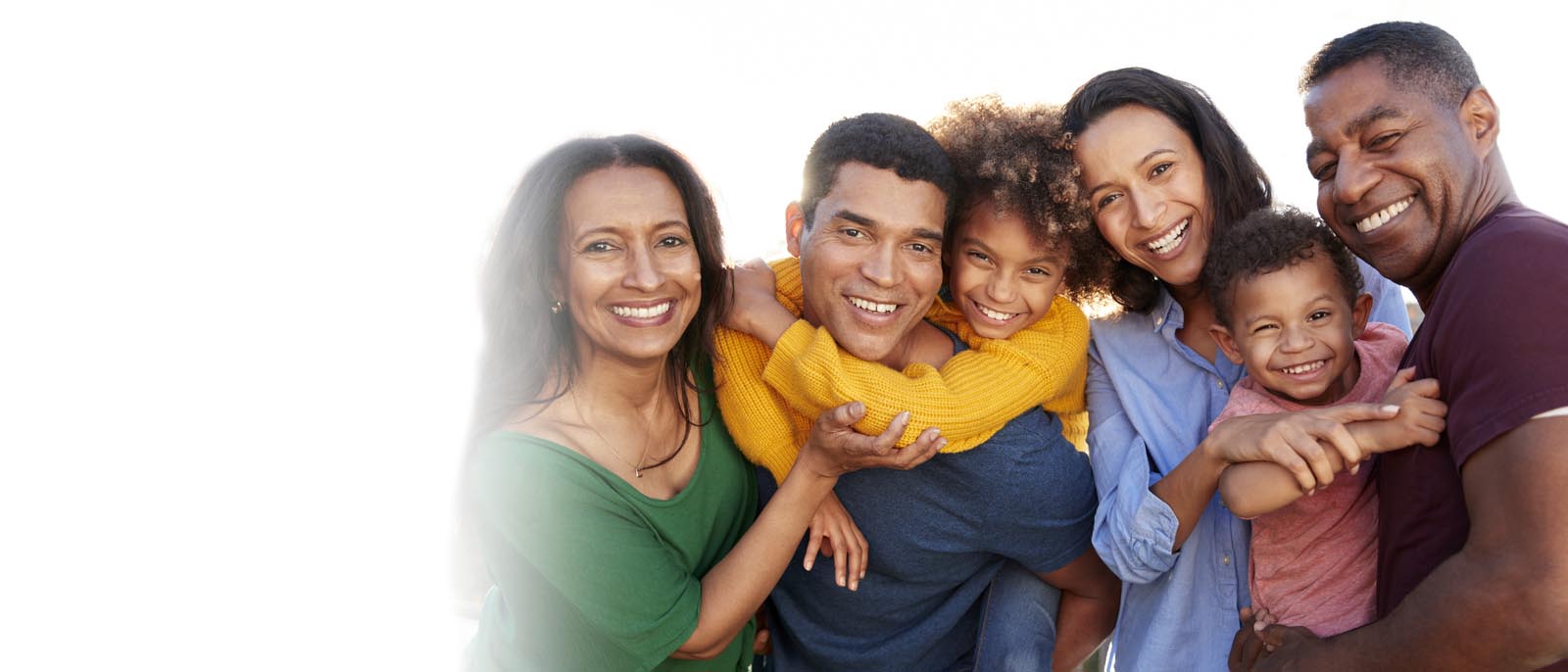 Smiling and happy multicultural families with children.